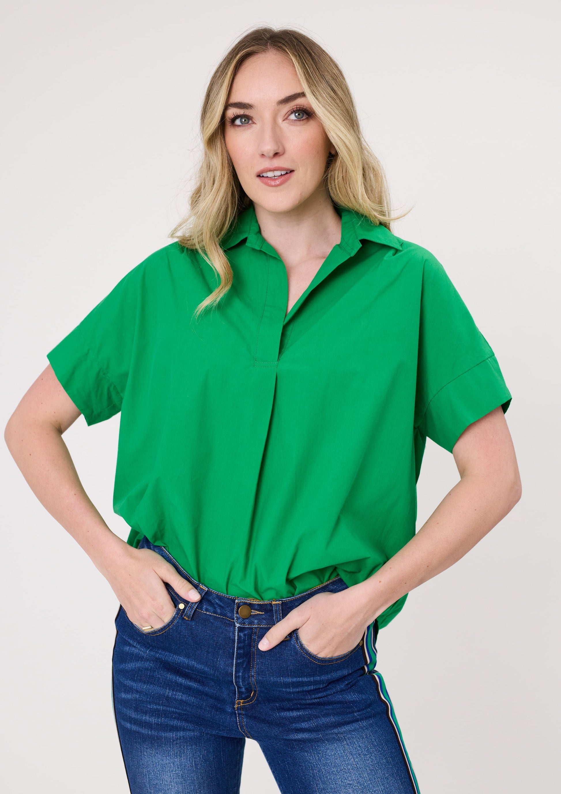 Dora Top in fresh green with a classic collar, made from 100% cotton for breathable comfort.