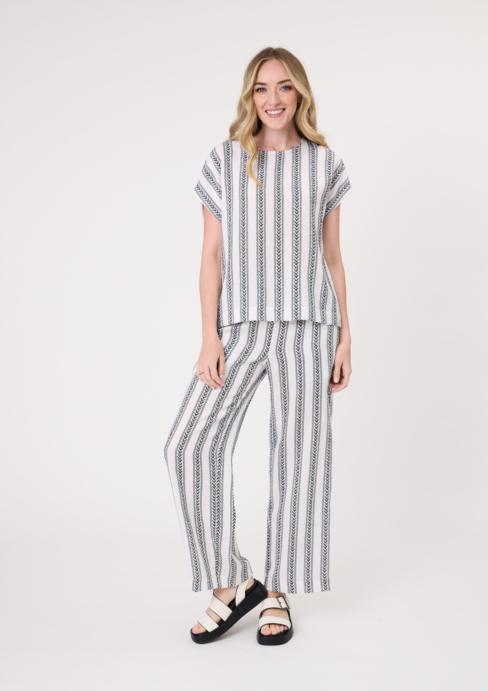 Melani Top in white print with short sleeves and a relaxed fit, made from 100% viscose for a soft, breathable drape.