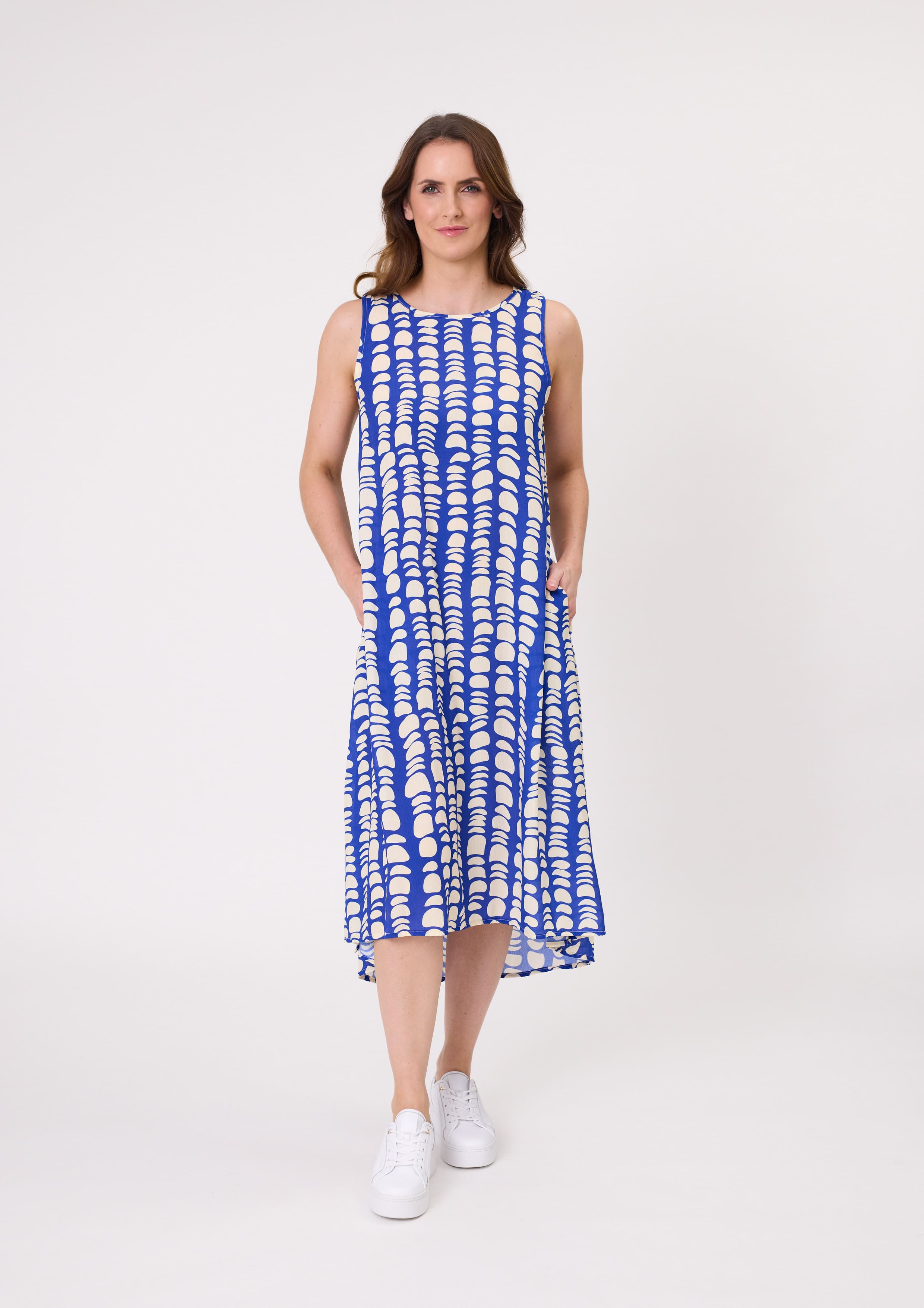Ana Dress in cobalt blue and white print with a sleeveless midi silhouette and hidden pockets, made from a soft, breathable rayon-viscose blend.