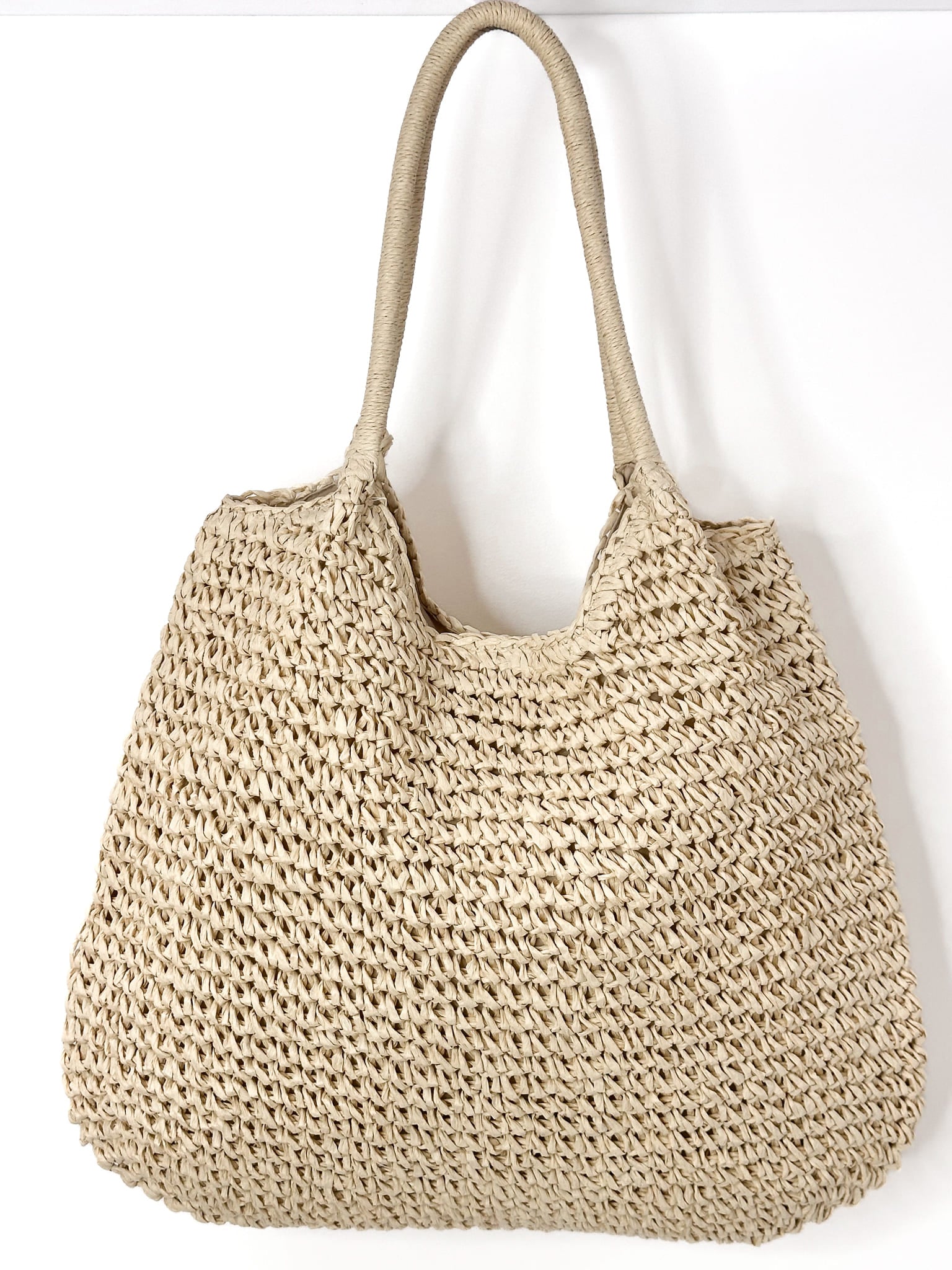 Capri summer tote bag in natural woven raffia with sturdy handles, spacious design, also available in black.