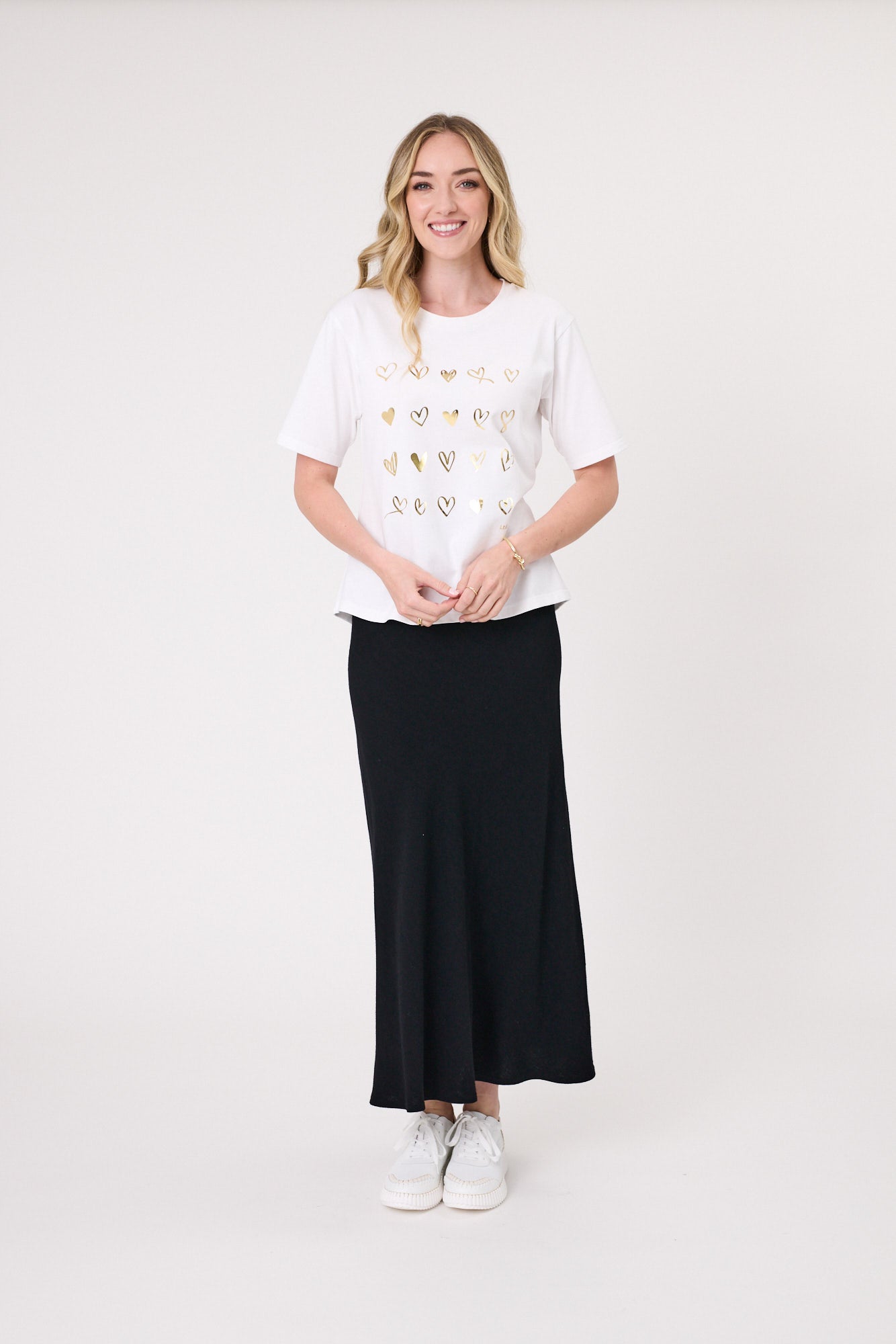 Carina Tee in white with gold foil heart detailing, featuring a classic round neckline and short sleeves.