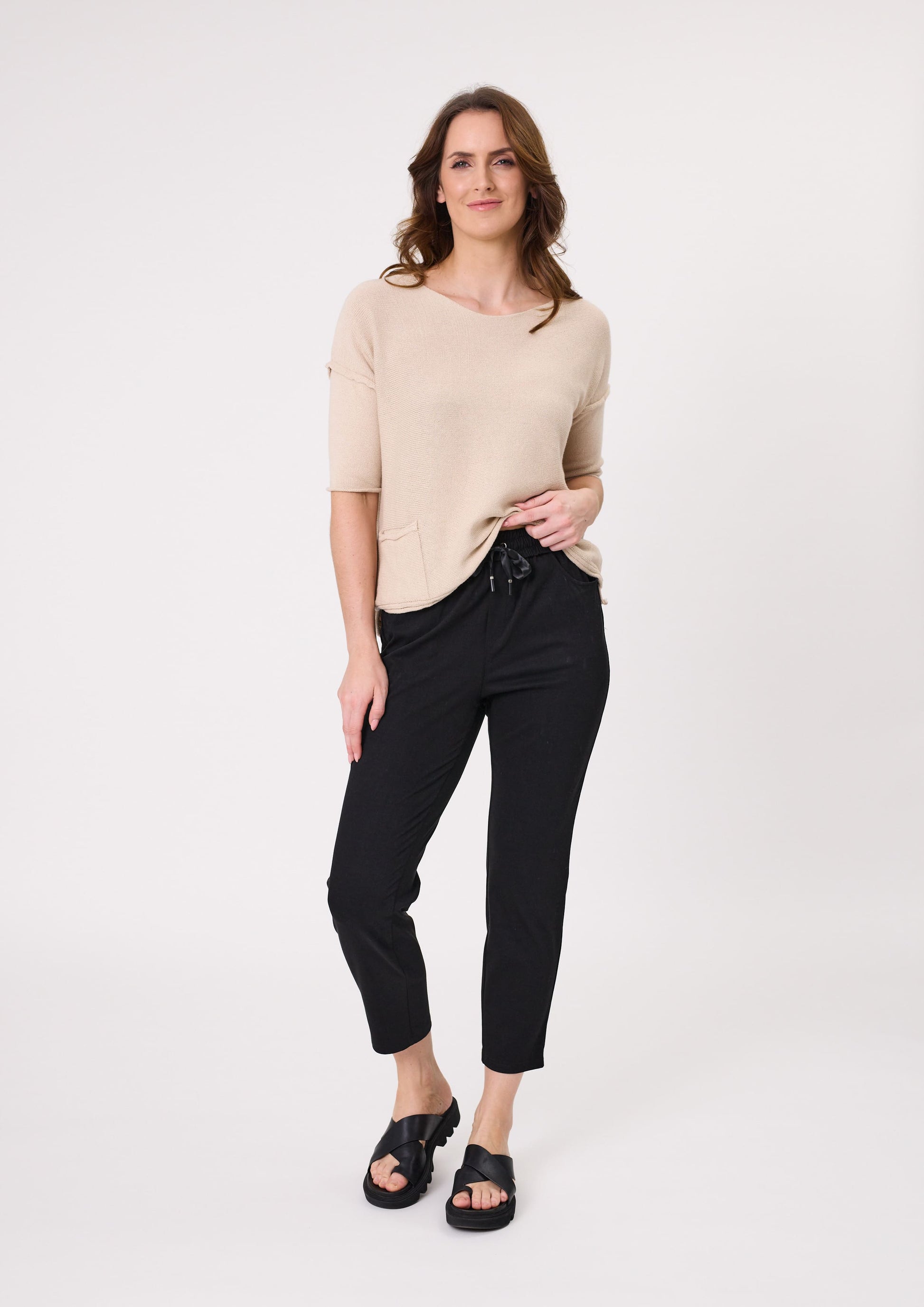 Gemma Pant in black with a slim, ankle-length cut, elasticated waistband with satin ties, and side and back pockets, made from a soft cotton-viscose blend.