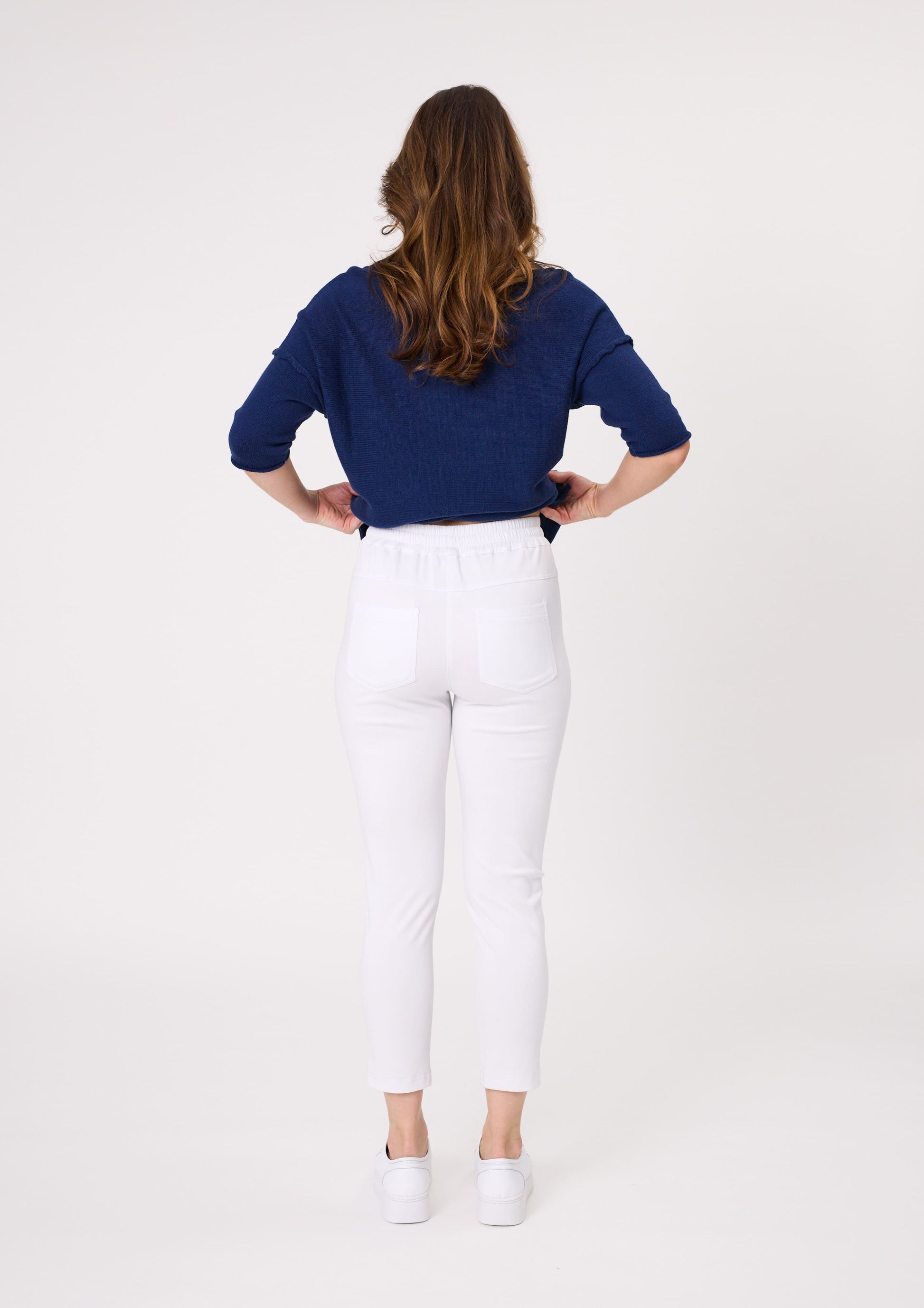 Back view of Gemma Pant in white showing elasticated waistband and two functional back pockets.