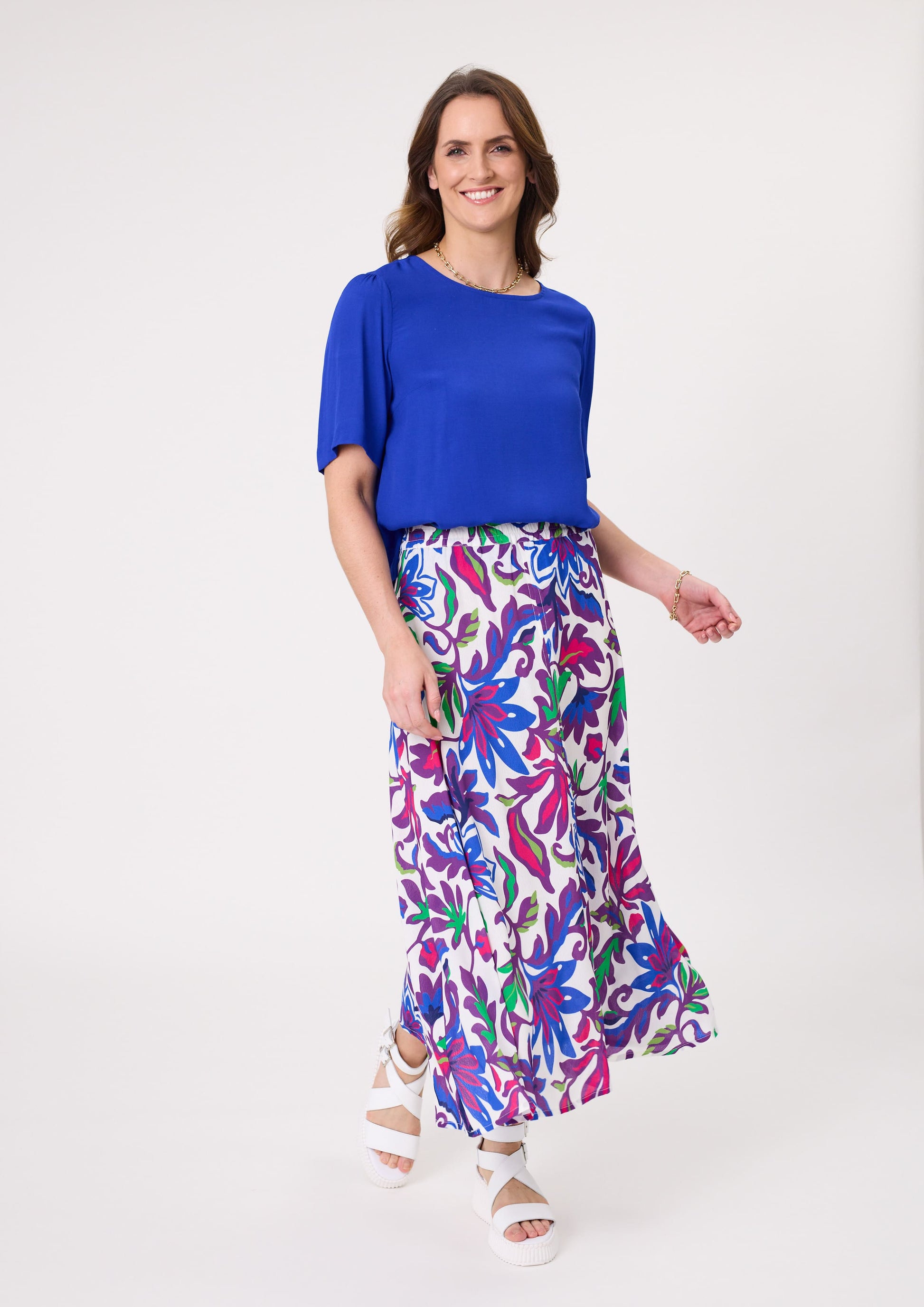 Ginevra Skirt with bold floral print in vibrant shades, featuring a flowy midi length and made from a soft, breathable rayon-viscose blend.