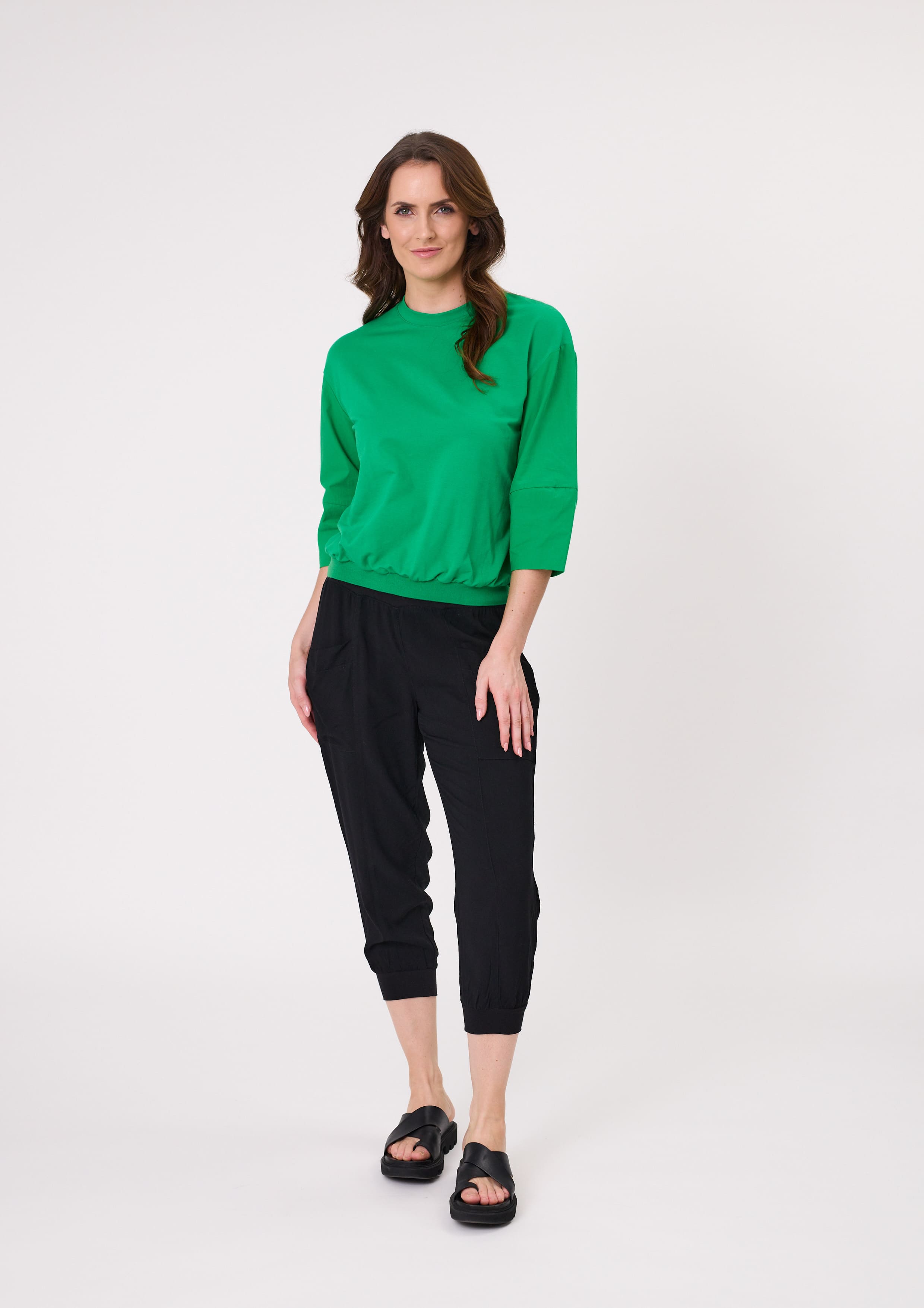 Harem Pant in solid black with a loose fit, cropped length, and side pockets, made from a lightweight, breathable viscose blend.