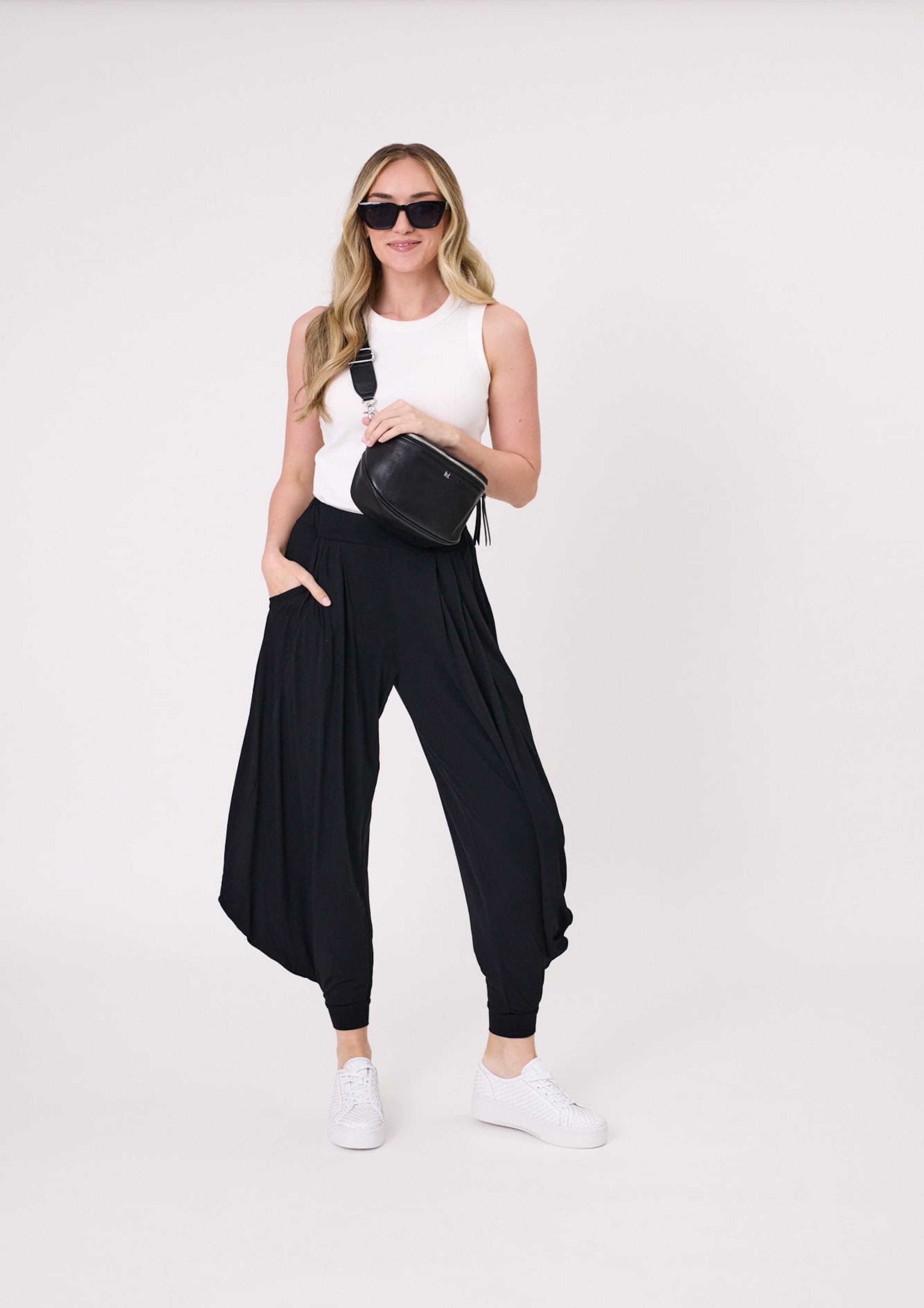 Lenka Pant in black with a cropped length, elasticated cuffs, and relaxed loose-leg fit, made from a soft, stretchy viscose blend.