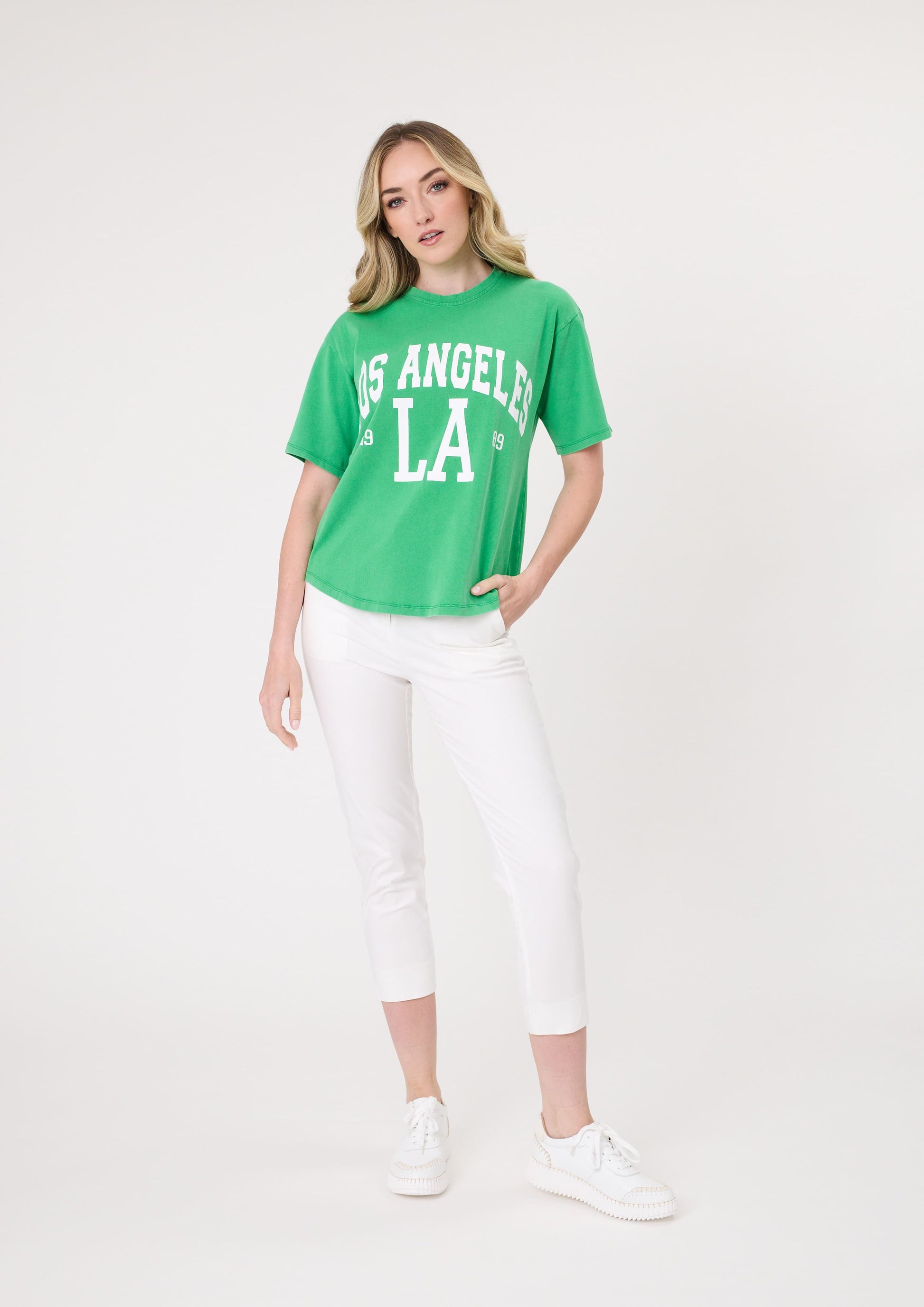 Los Angeles Tee in green, with bold multicoloured front print, scoop neckline, and short sleeves, made from 100% cotton for a relaxed fit.