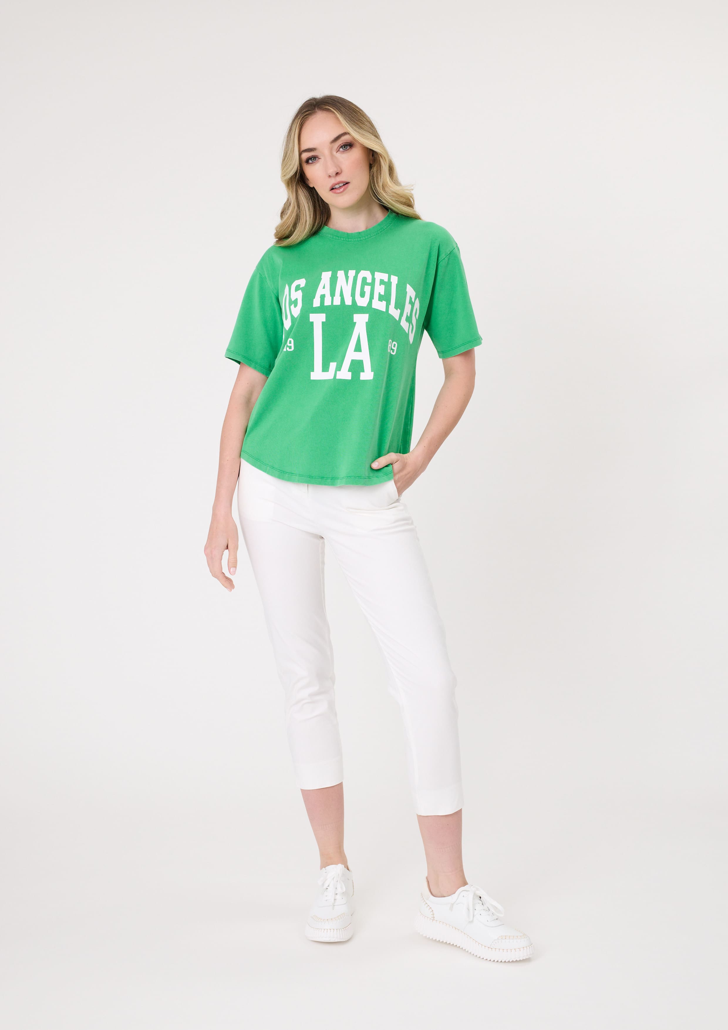 Los Angeles Tee in green, with bold multicoloured front print, scoop neckline, and short sleeves, made from 100% cotton for a relaxed fit.