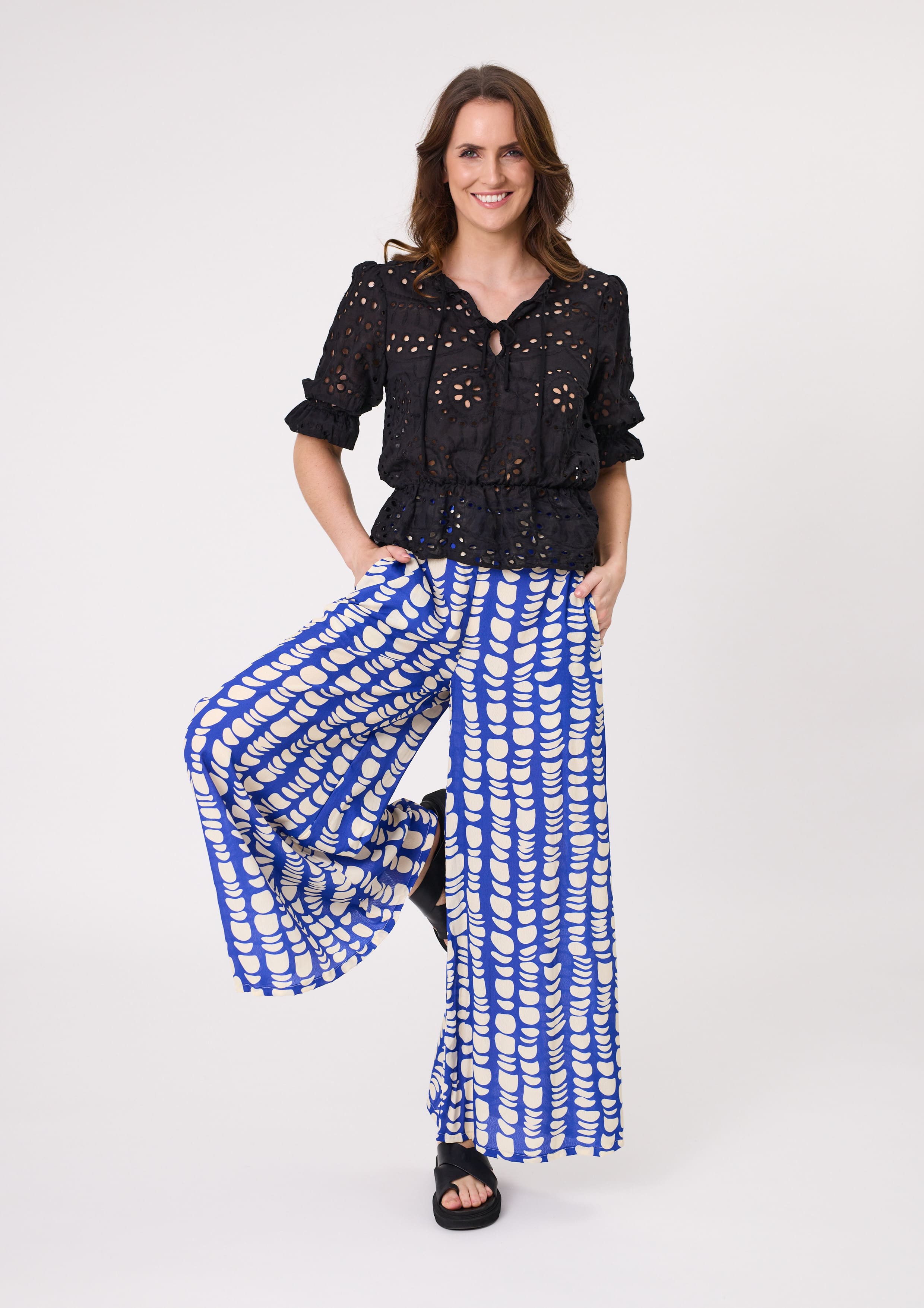 Massima Pant in cobalt blue and white print with a wide-leg silhouette, flowy drape, and practical pockets, made from a soft, breathable rayon-viscose blend.