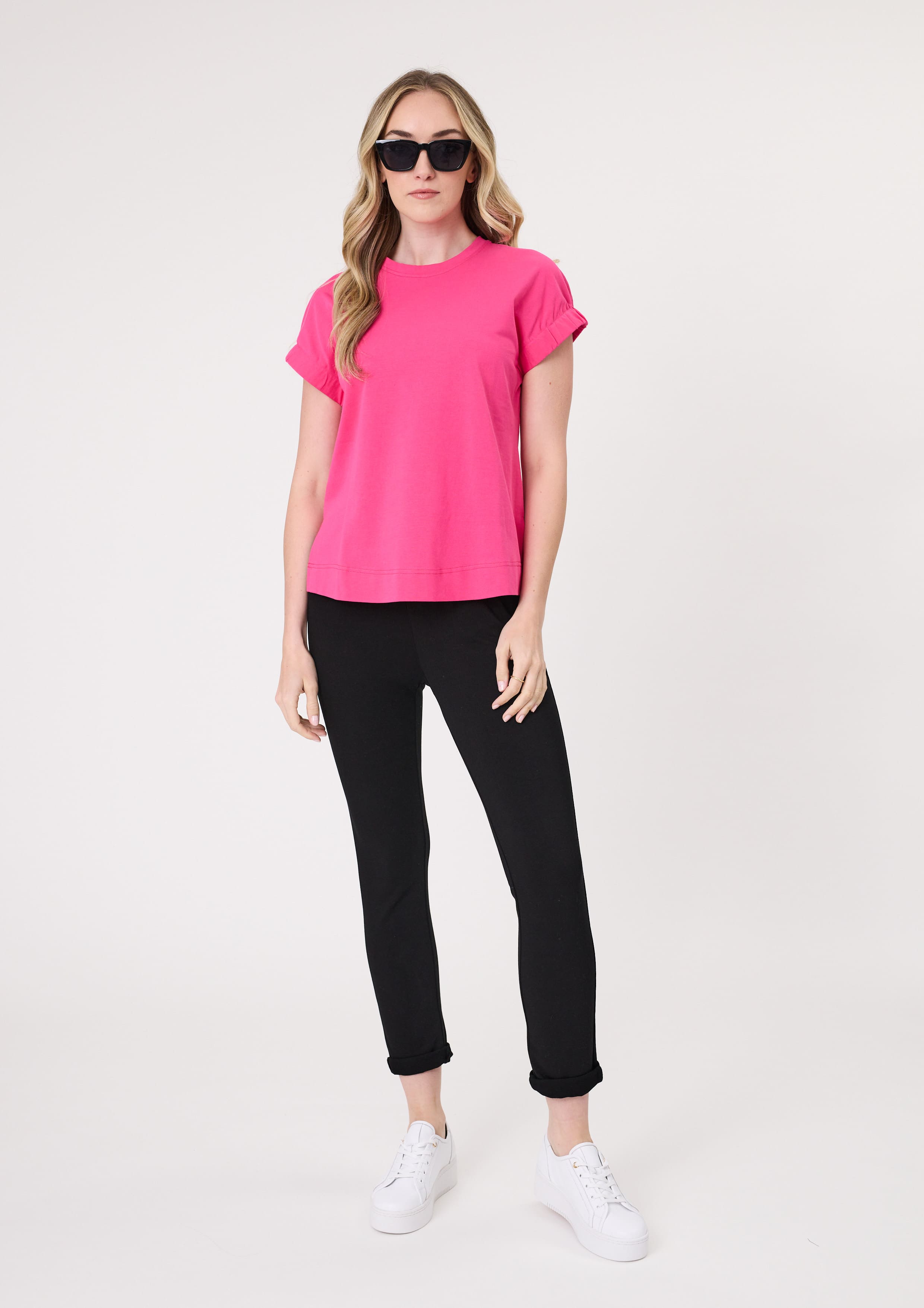 Michaela Tee in fuchsia with a round neckline and softly cinched short sleeves, made from 100% cotton.