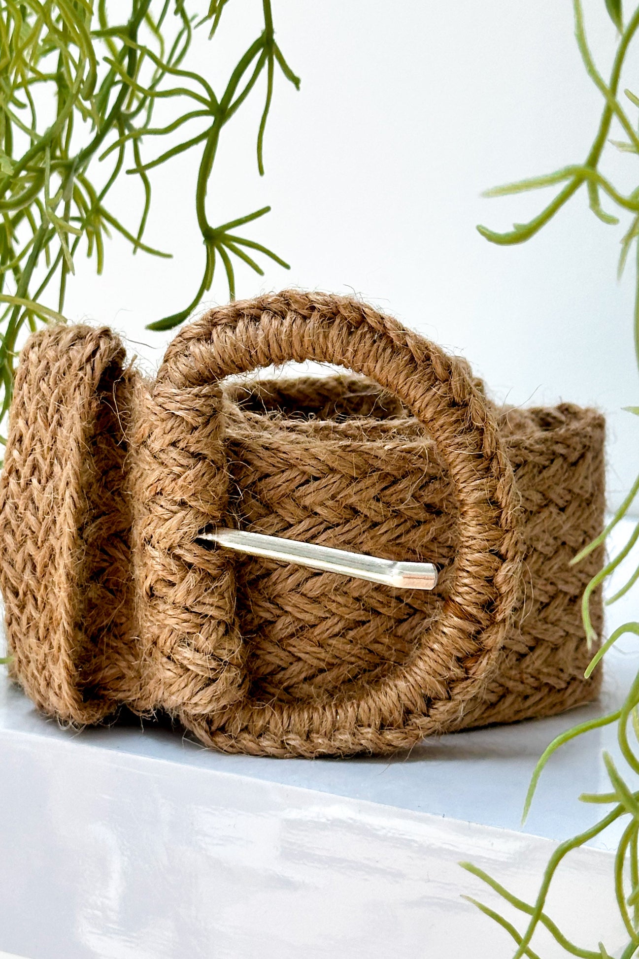 Palma Belt in natural raffia with a woven design, ideal for cinching dresses or adding shape to tops with a stylish, textured finish.