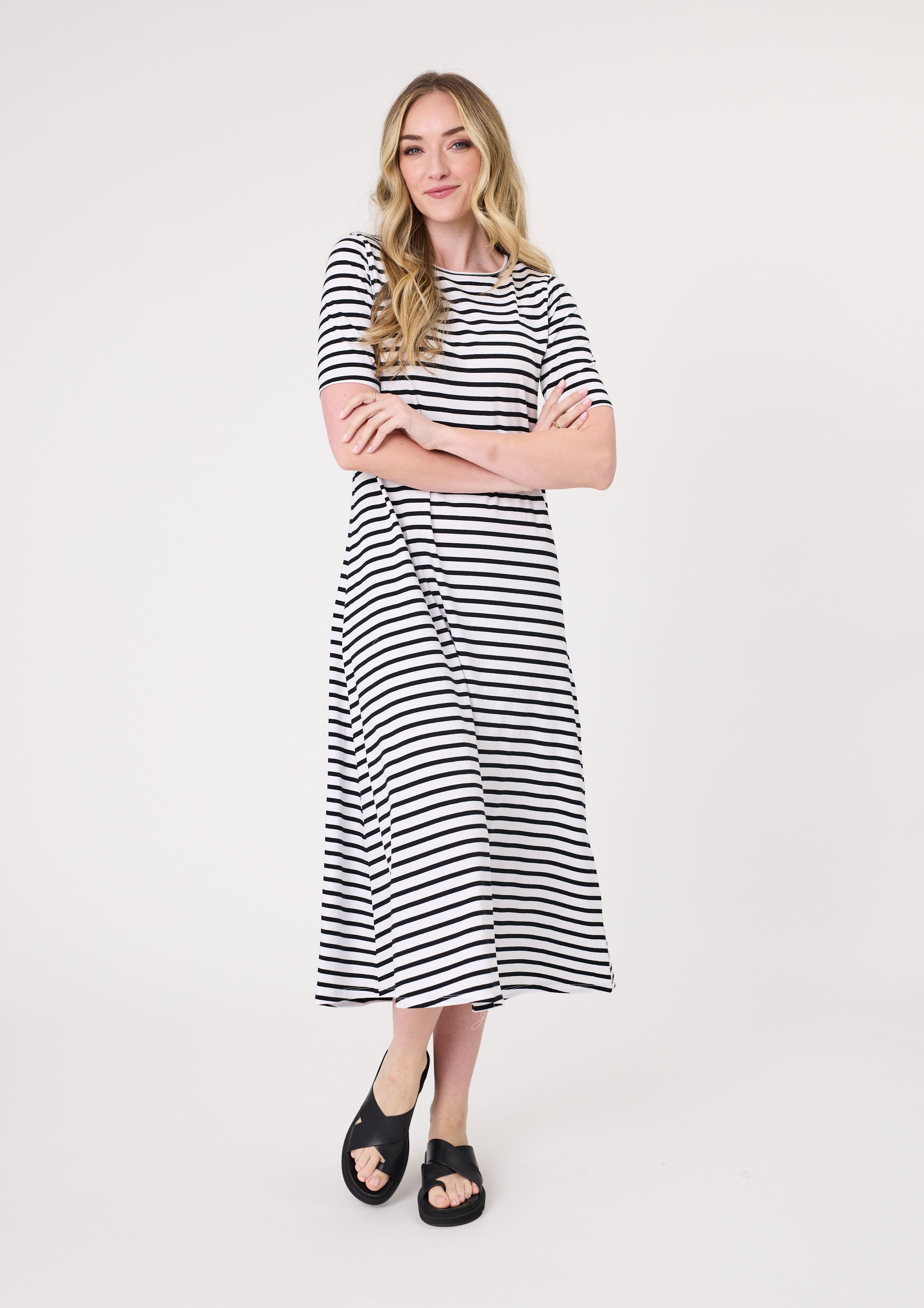 Sole Dress in black & white stripe with a midi-length silhouette and short sleeves, made from 100% cotton for breathable, all-day comfort.