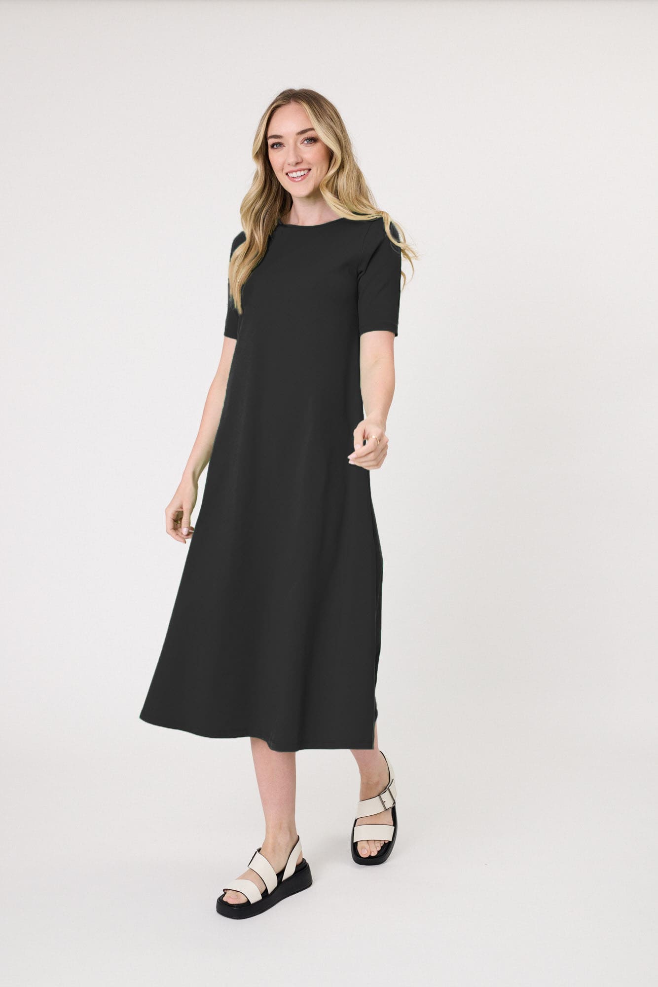 Sole Dress in black with a midi-length silhouette and short sleeves, made from 100% cotton for breathable, all-day comfort.