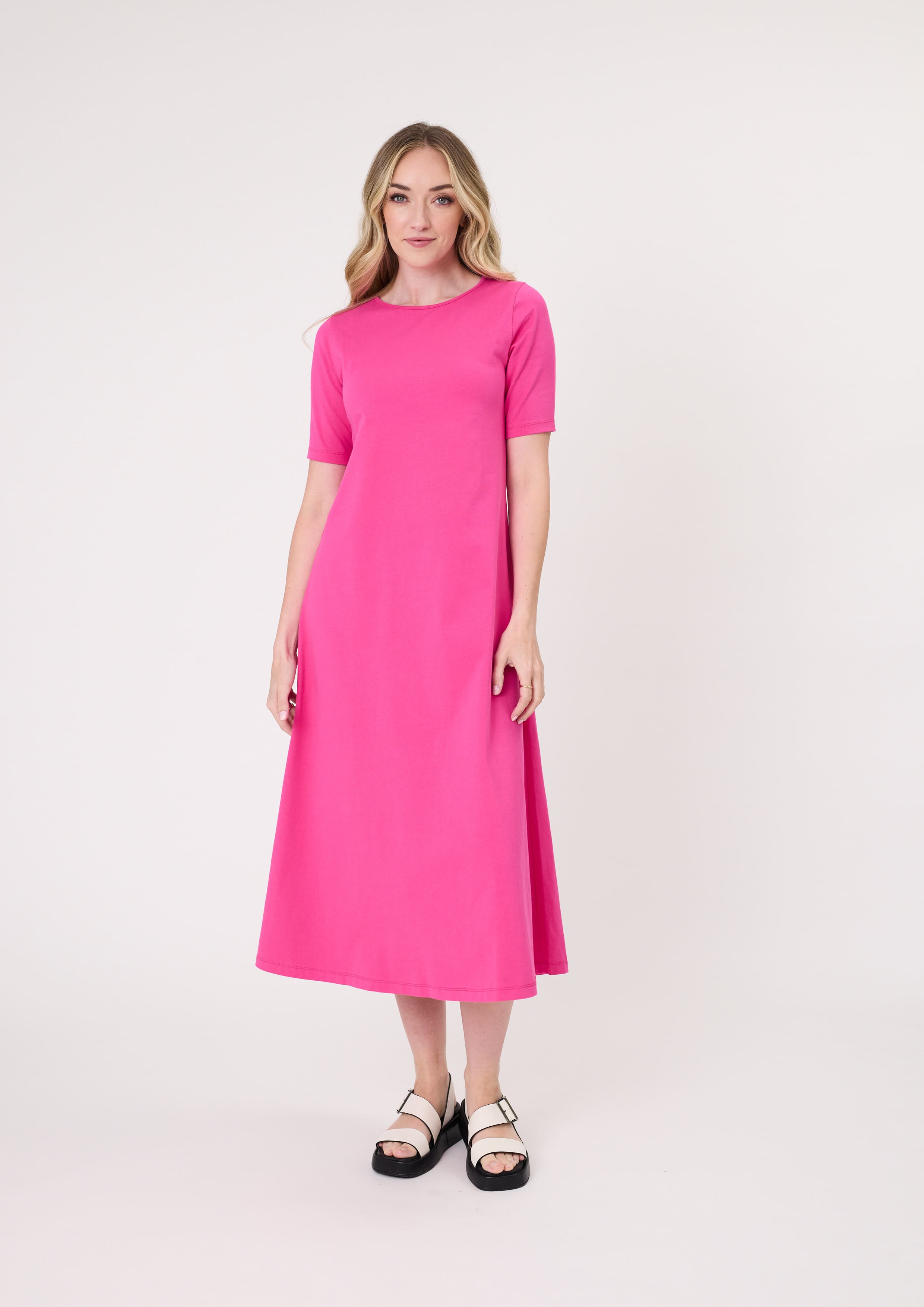 Sole Dress in fuchsia with a midi-length silhouette and short sleeves, made from 100% cotton for breathable, all-day comfort.